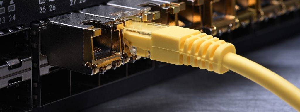 Copper SFP RJ45 transceivers in switch ports with an Ethernet cable connected